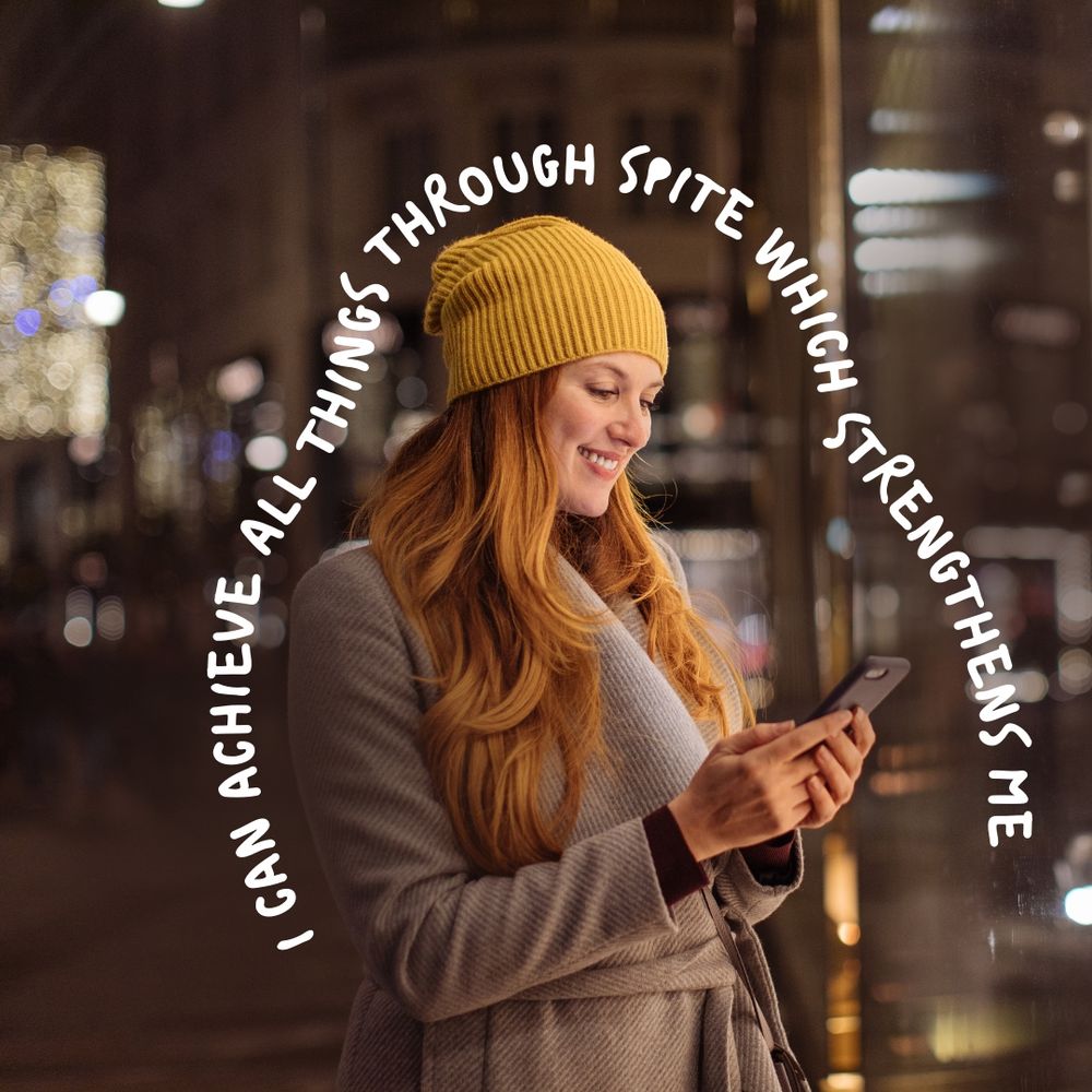 Woman in cozy outfit smiling and looking at her phone, but surrounded by the text: I can achieve all things through spite which strengthens me.