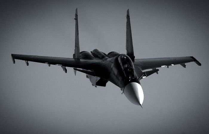 A black and white image of a Russian Su-30SM Flanker-H.