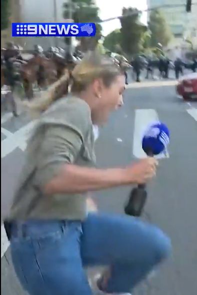 LEO shoots 9 News Australia's American correspondent Lauren Tomasi in the leg live on the air.
