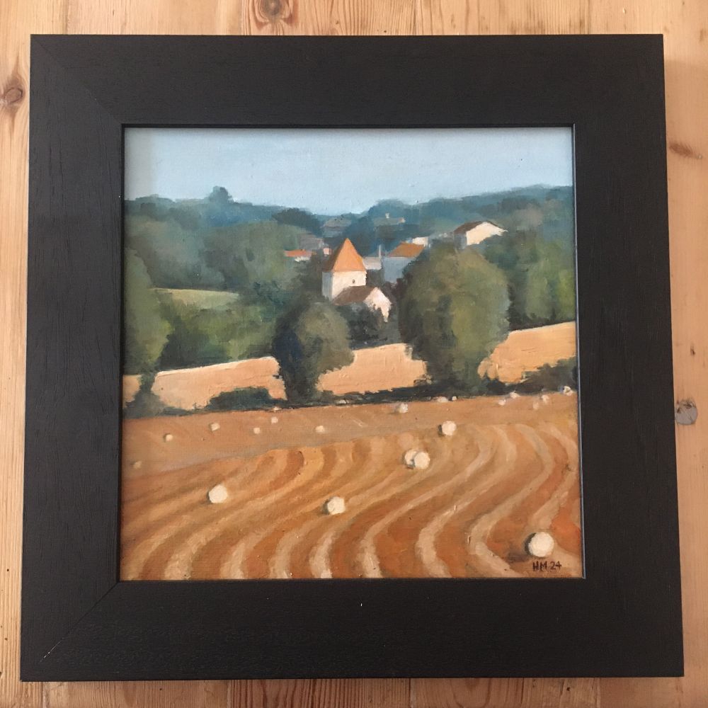 Framed oil painting of a church amidst harvested fields, deep in rural France