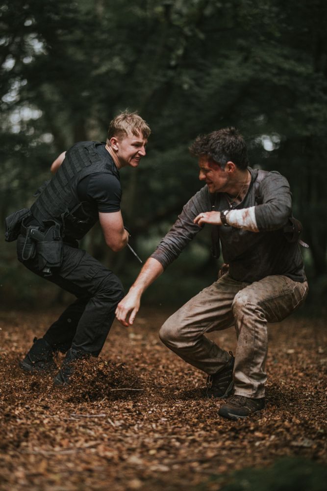 Nathan Drake ducks low under the knife of a Shoreline soldier.