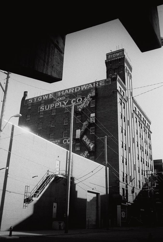 A black and white photo of an old industrial building in Kansas City. 