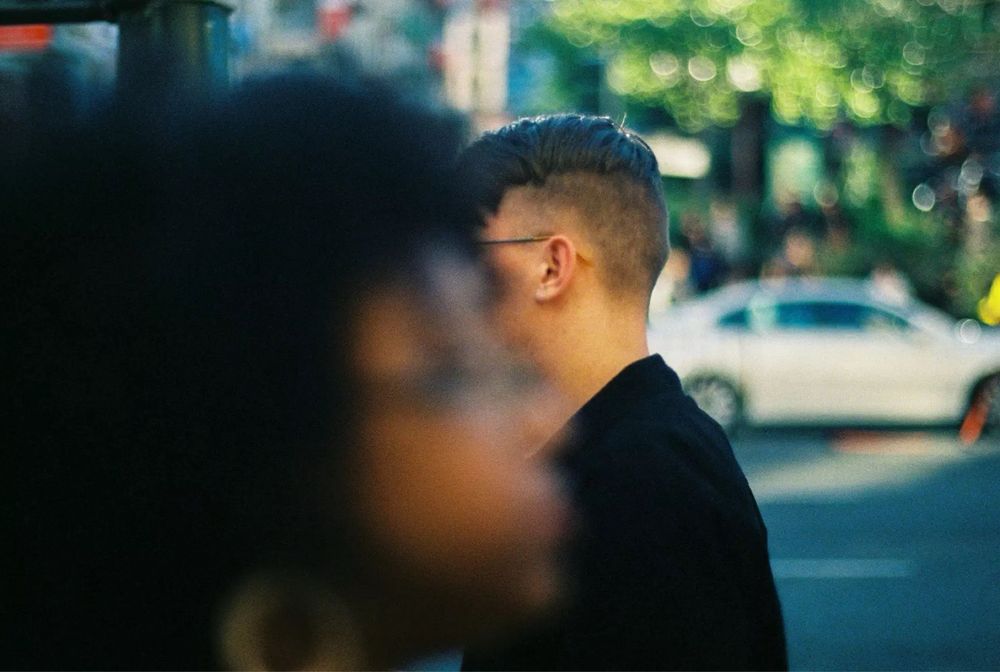 Strangers passing on the street in Chinatown, SF. 