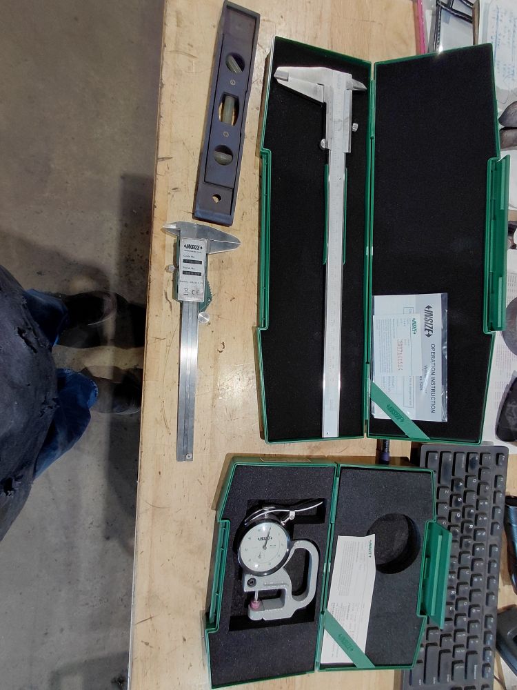 A collection of tools on a desk.