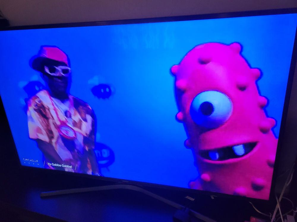 Flavor Flav standing next to Muno from Yo Gabba Gabba on a Coachella livestream.
