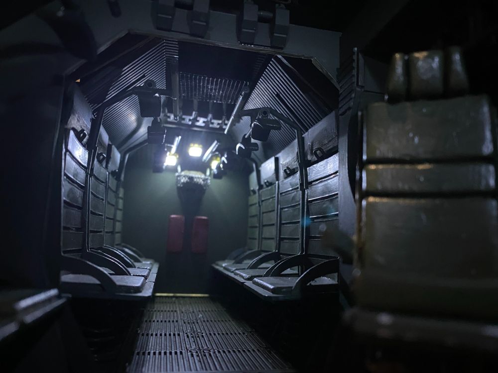 A photograph of the rear cabin of my APC model, with moody lighting.