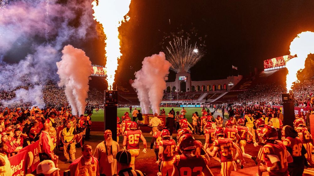 The Trojans — seen coming onto the field to face Michigan State on Sept. 20 — are using real-time data to make key decisions. (USC Photo/Bryce Dechert)