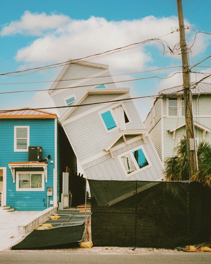 A photo of a house falling down onto another house #art #photography #filmphotography #leica #lomography