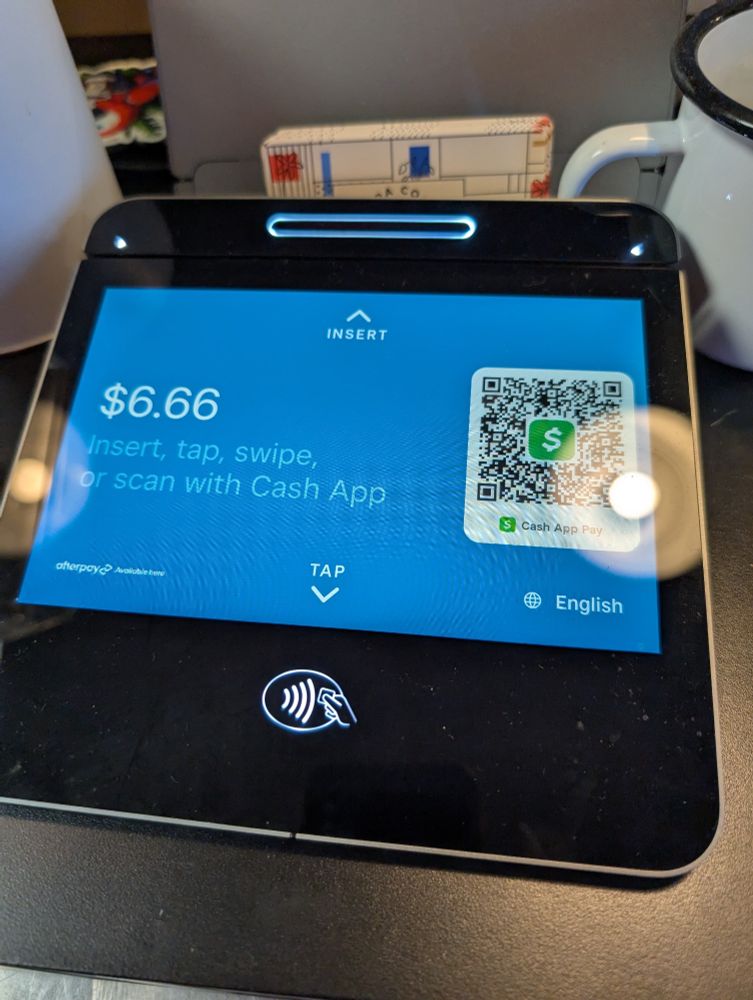 POS tap-to-pay screen with $6.66 as the price
