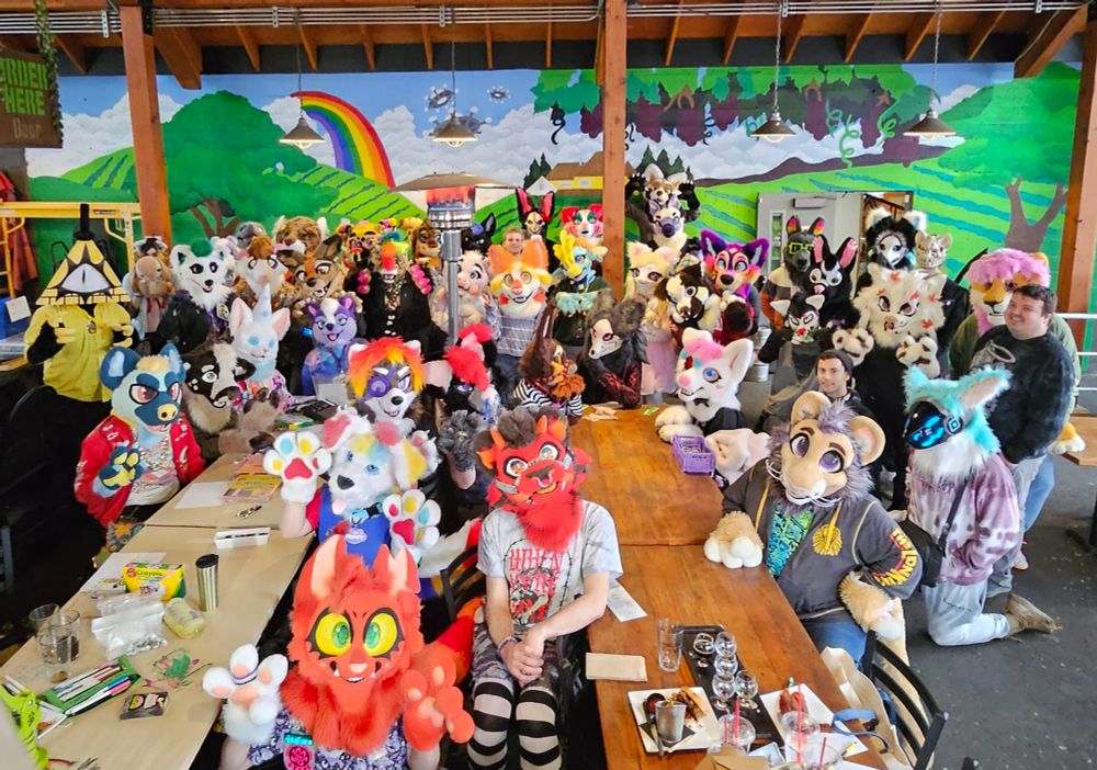 A group photo of 77 furries at Feral TapHouse