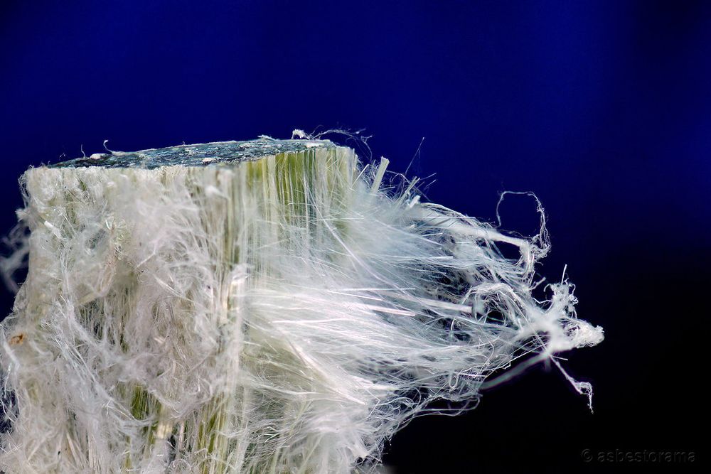 chrysotile mineral chunk, fibrous delamination present.The fibres are white and fluffy in appearance, appearing like candy floss; they clump and felt like cat fur. Where they remain together a deep rich forest green colour is seen. pulled from asbestos pix flickr, 1/09/25