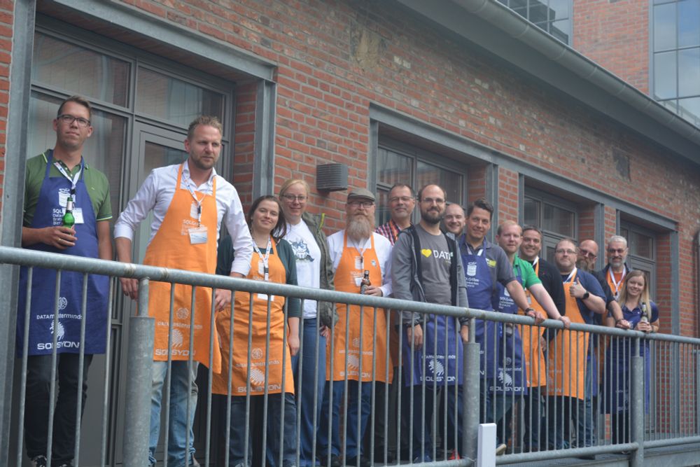 The proto New Stars of Data (in orange) and their mentors (in blue) stood on the balcony
