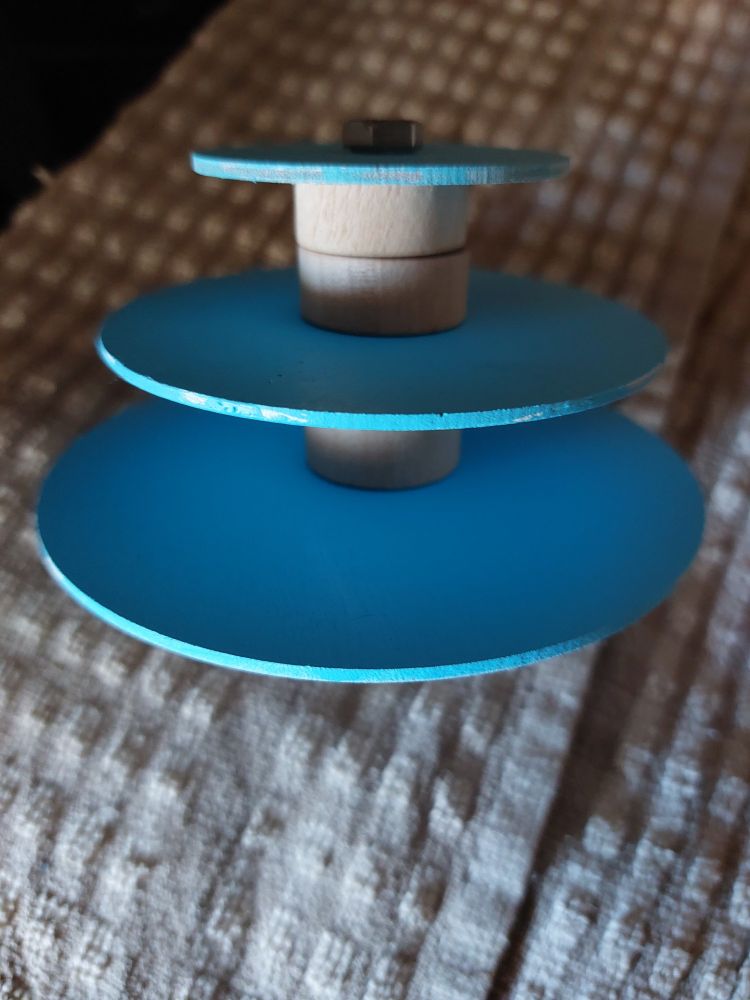 Light blue painted plywood discs