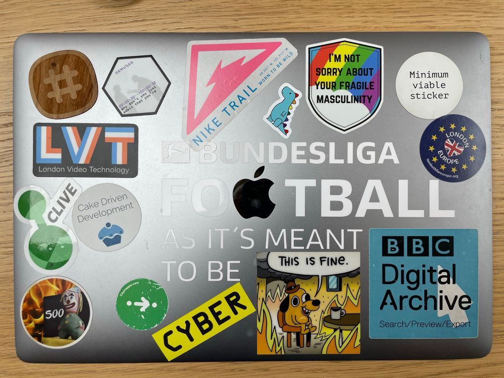 Laptop with a collection of stickers on it 