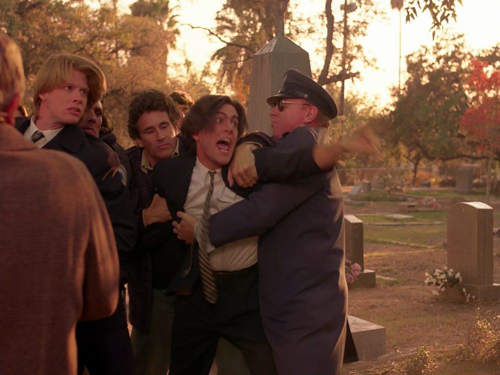 Bobby being held back from lunging at James during Laura’s funeral. Twin Peaks S01E04 - Rest in Pain.