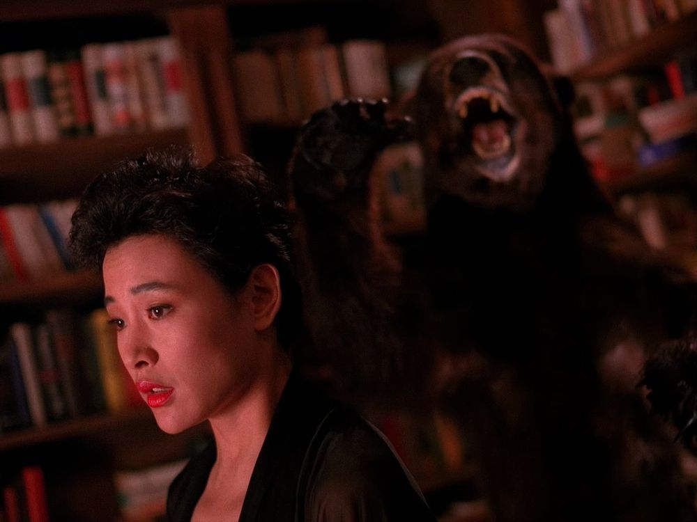 Josie with a stuffed bear behind her. Twin Peaks S01E05 - The One-Armed Man.