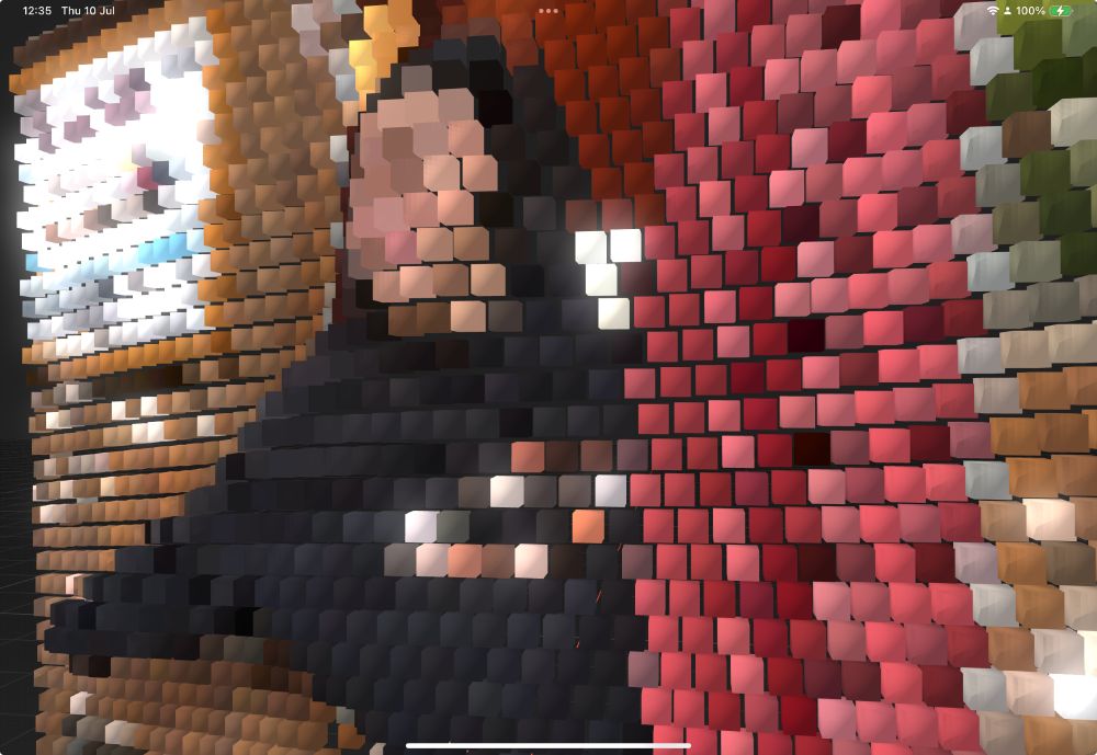 Recorded 3D point cloud recording of a woman in a photo booth rendered as cubes.
