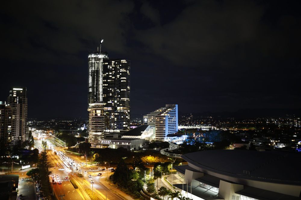 Image of the Gold Coast Skyline at night with parts of the convention center.