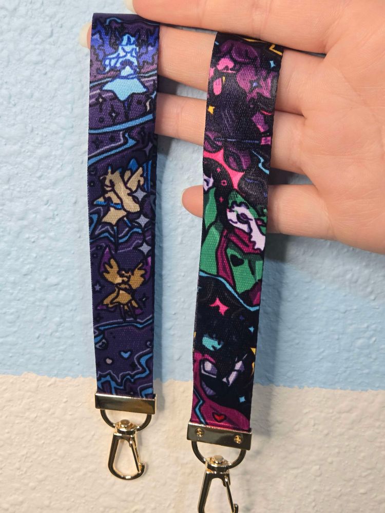 Two lanyards one has fairys on it the other the deltarune main cast