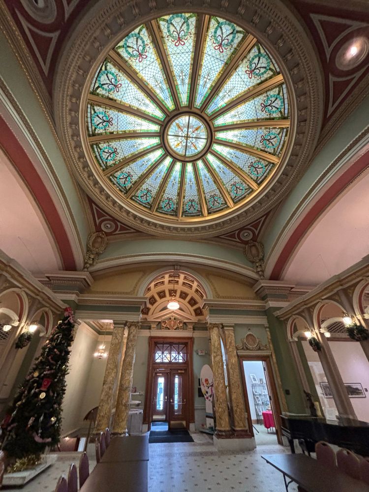 View of stained glass dome and front entrance doors of a museum