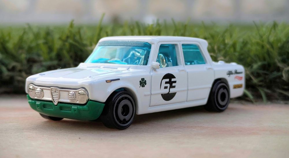A Hot Wheels Alpha Romeo Julia TI Super with some (fake) grass background. 