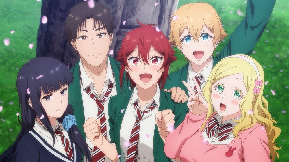 A shot from the ending of the anime Tomo-chan Is A Girl! featuring Tomo in the center, Misaki and Carol to her right, and Jun and Gundou to her left. They’re all smiling up at the camera, even Gundou, slightly.
