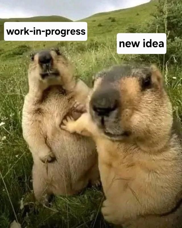 Two marmots. One is shoving the other back with one of its paws. The shoving marmot is labeled, "new idea," and the shoved marmot is labeled, "work-in-progress."