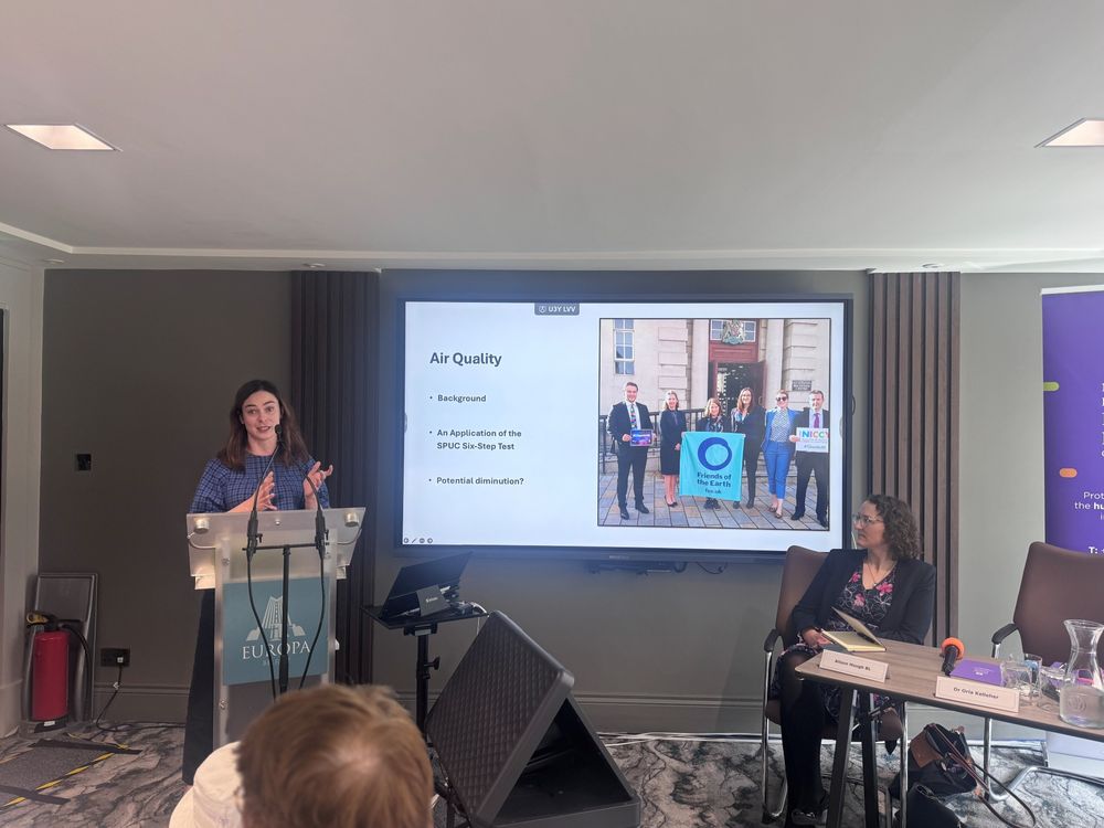Dr Orla Kelleher presents research findings at the podium. 