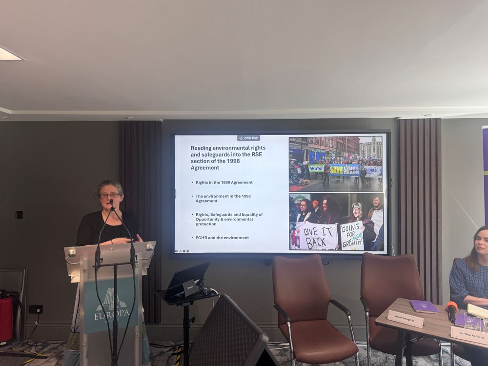 Dr Mary Dobbs presenting research findings at a podium. 
