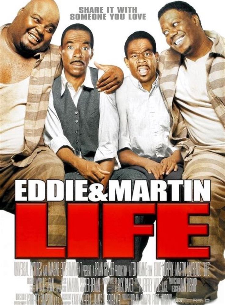 Image of Claude (Martin Lawrence & Ray (Eddie Murphy) looking shocked while sitting between to prisoners(Bernie Mac & Mike Taliferro RIP)