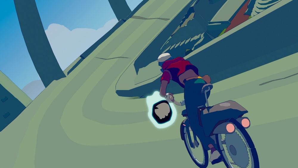 A velodrome-like location with a cyclist on a bike driving on it, and a floating skull in front of the bike.