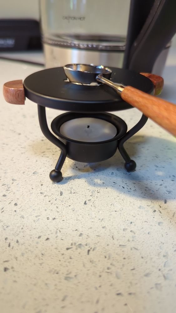 Close up view of the wax melter with tealight candle.