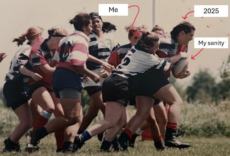 A group of women grappling over a rugby ball with a much smaller woman trying to take hold of the ball while a tall woman runs forward with the ball in her hands