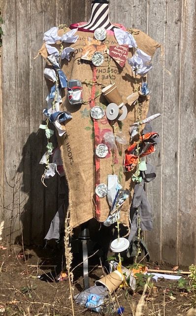 dressmaker's mannequin modelling coat made of waste