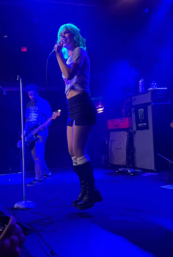 Scowl frontperson Kat Moss appears to levitate while singing at the Fine Line in Minneapolis.