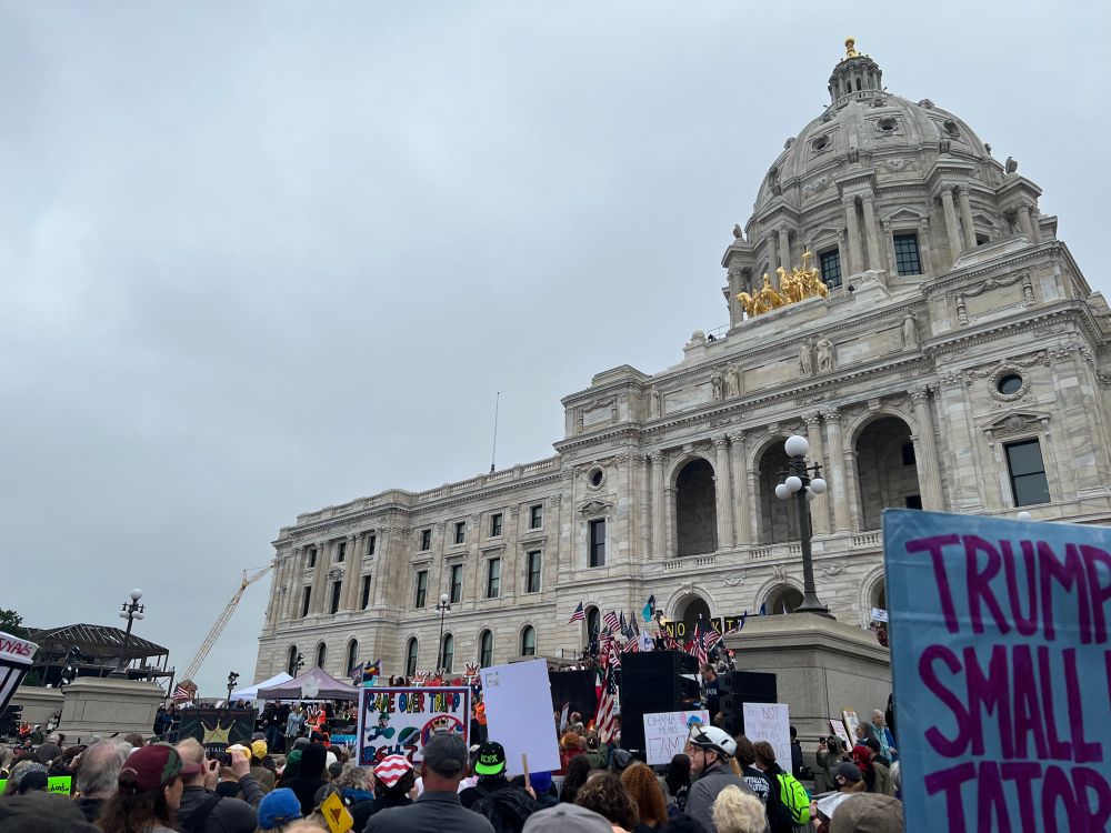 In the crowd close to the Minnesota State Capitol. Lots of people with signs.