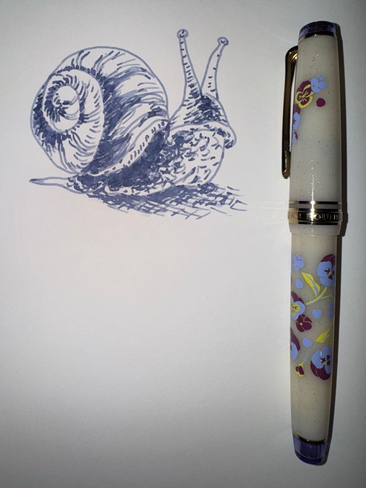 ink drawing of a snail next to a white Sailor fountain pen decorated with purple and yellow pansies