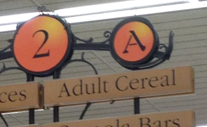 A grocery store aisle that offers "Adult Cereal"
