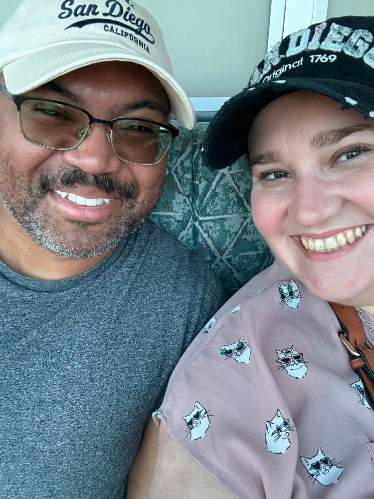 A picture of Jay and his wife Brandey smiling as they take a ride on the Sky Tower