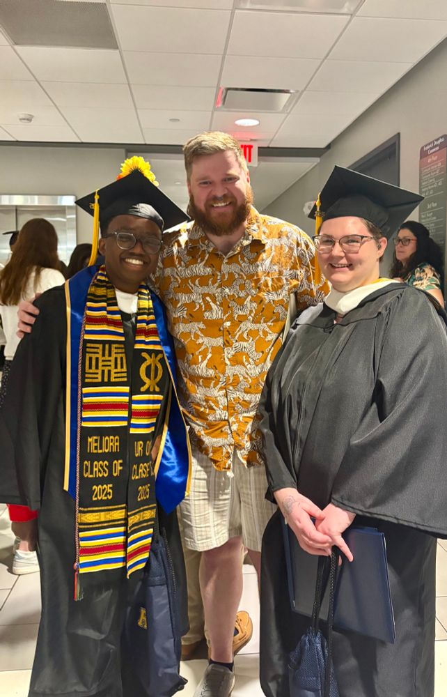 Me (center in a zebra print shirt) with my two students (the right and left) who graduated from our English undergraduate program today 
