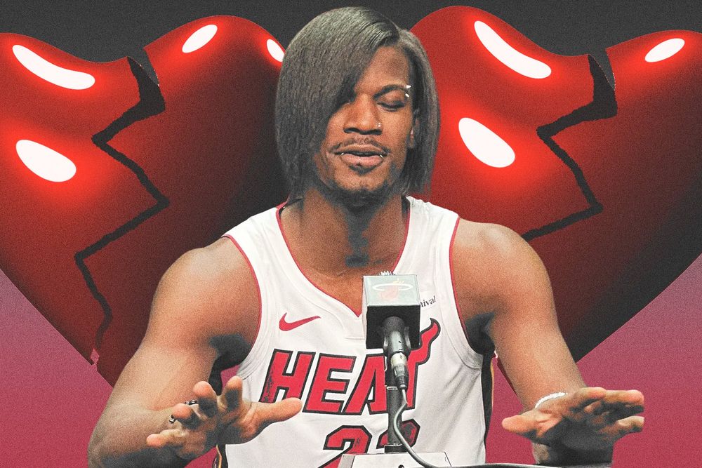 Jimmy Butler with an emo hairstyle in front of a background consisting of two broken cartoon hearts.
