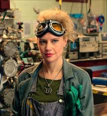 Kate McKinnon as Jillian Holtzman in Ghostbusters (2016). "Virgo. Avid skier. Gluten-full. And 100% jazzed to meet you"