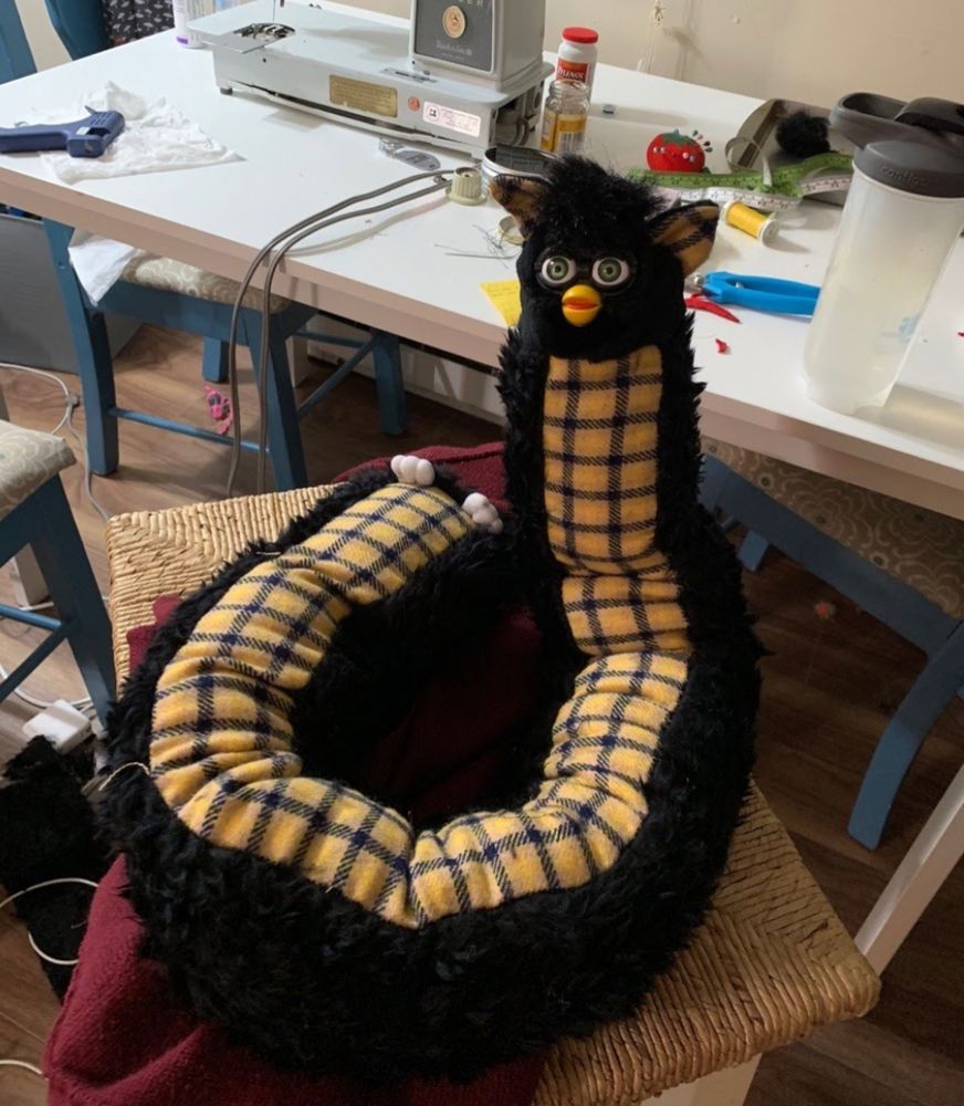 STRANGE AEONS' long furby. Functions like a foxfur scarf but with the fox still inside.