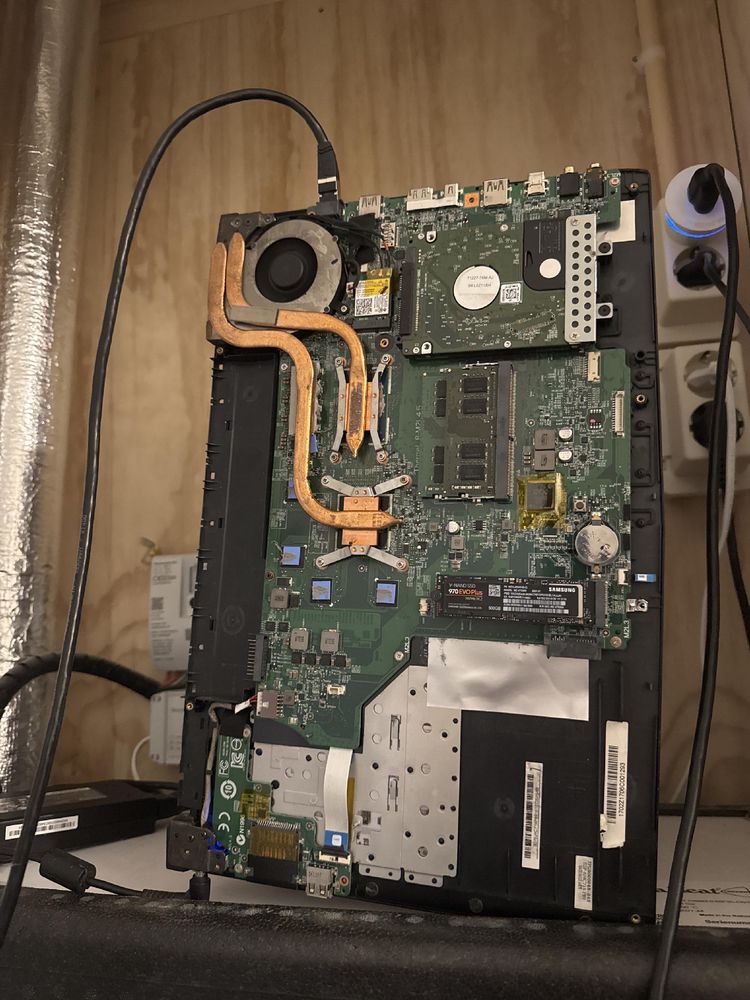 A naked laptop inside a water meter cabinet