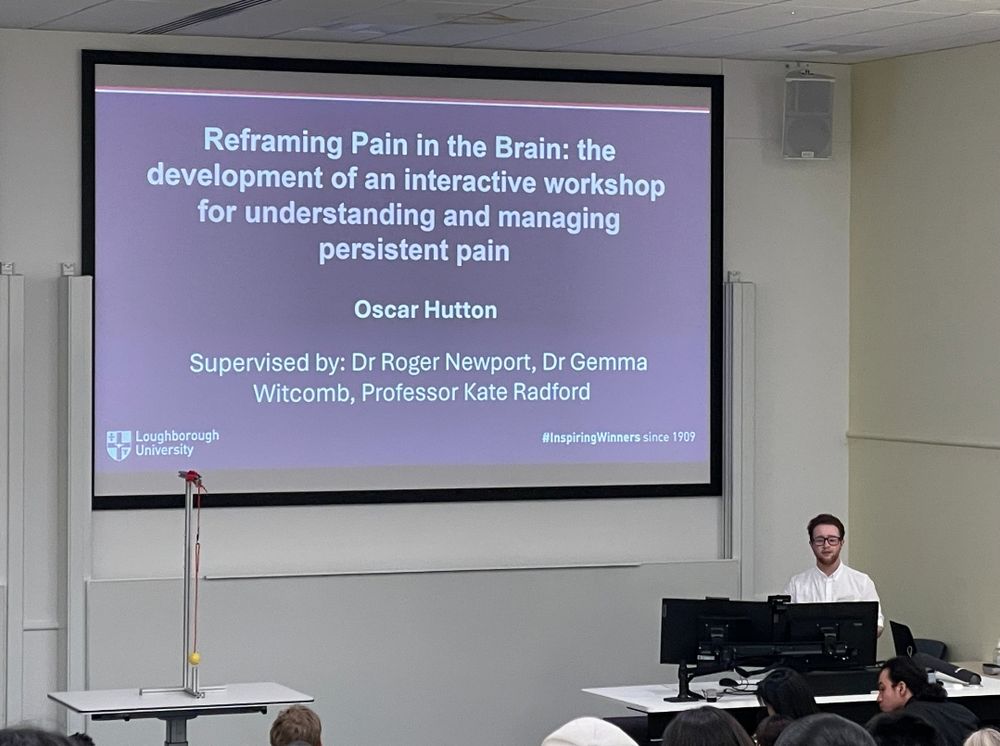 Oscar presenting a slide entitled Reframing Pain in the Brain: the development of an interactive workshop for understanding and managing persistent pain