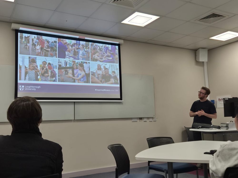 Oscar presenting in a classroom - pictures of demonstrations on the slide.