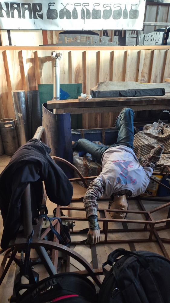 An upside down mannequin that has taken a terrible fall