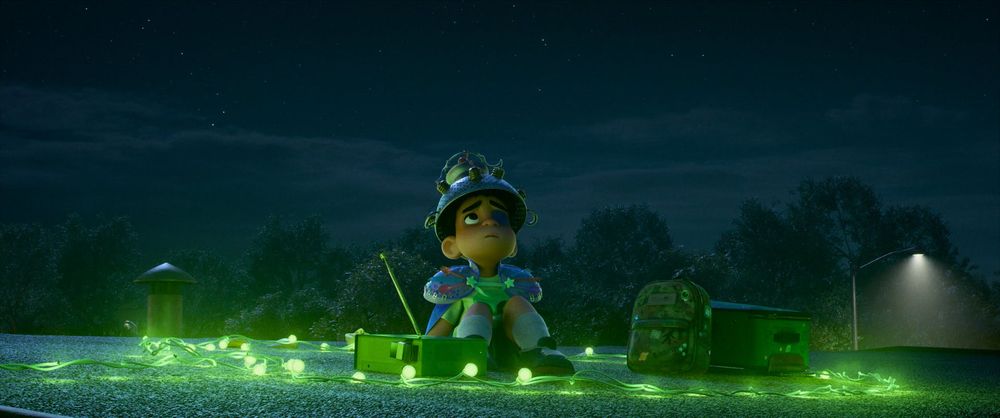 Elio waits to be abducted in a circle of green lights in the animated film 