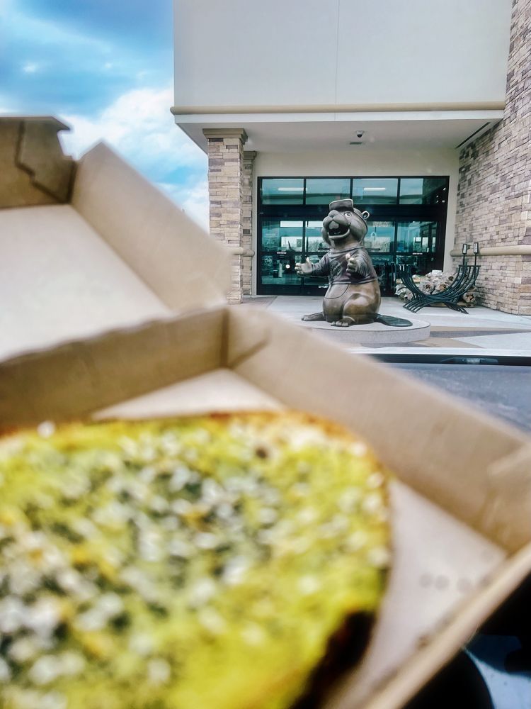 avocado toast and the bucees bronze statue outside the store 