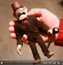 a photo of a stop motion figure of Stan Pines (who has a scared expression) held in someone’s hand